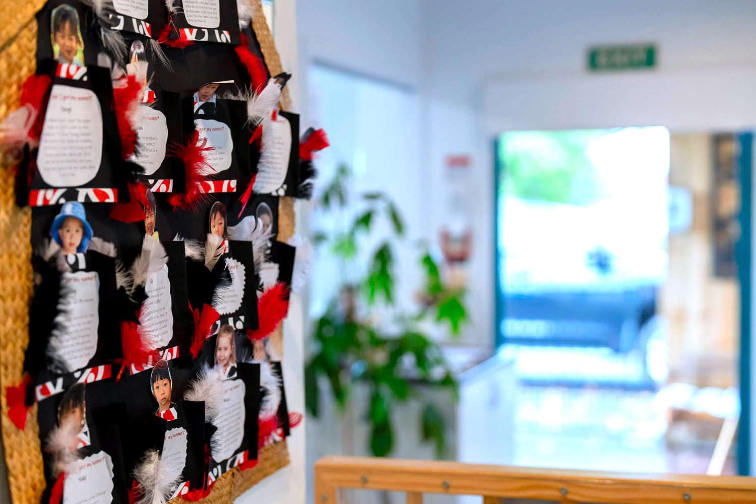 Teacher's handmade communication pockets for each pupil on childcare wall